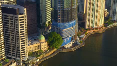 customs house restaurant and under construction building of 443 queen street at the riverbank in brisbane city, australia