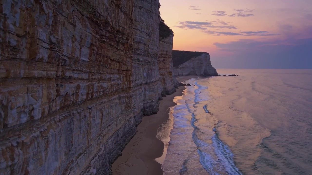 Aerial View of Dramatic Coastal Cliffs at Sunset