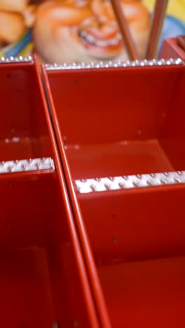 empty red bins of a carnival game