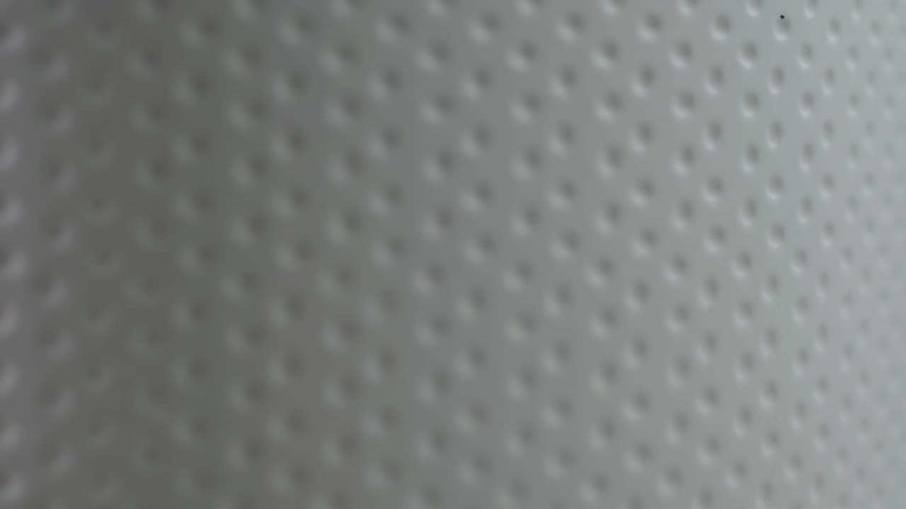 el fondo brillante abstracto con hendiduras circulares se mueve lentamente.