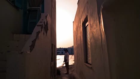 alley with exit to the sea at dawn