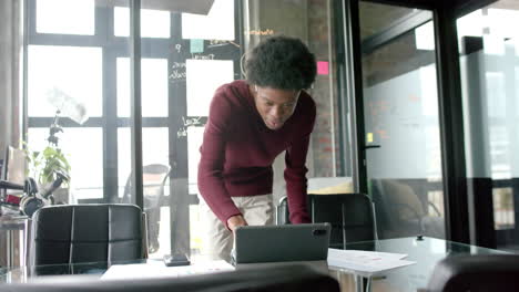 african american casual businessman using tablet at home office, slow motion, copy space