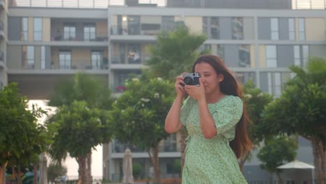 professional photographer, woman clicks photos using old soviet camera