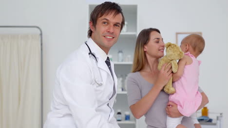 doctor with a mother and her baby