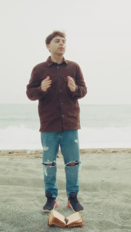 man praying with passion on the beach with the bible book