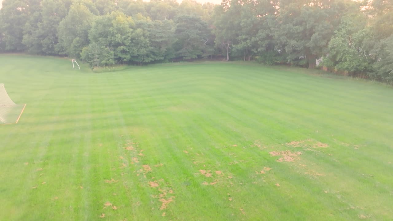 Rising from a Soccer Field to show surrounding area's smoke cover