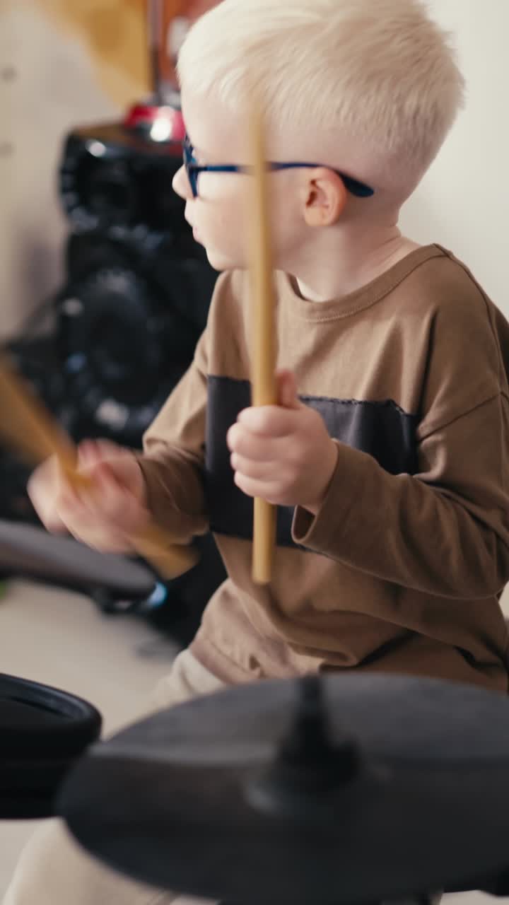 Young boy playing electronic drums