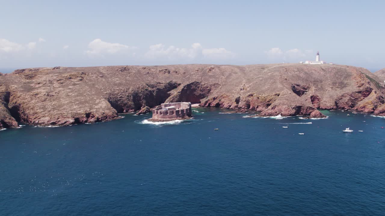 Aerial: Portugal's Berlengas Archipelago, fort and lighthouse in the backdrop