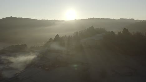 Sun-illuminate-countryside-on-foggy-day