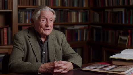 elderly man in a library setting