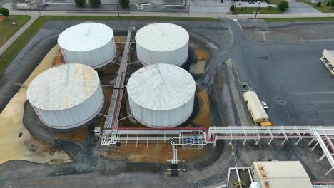 tilt up aerial reveal of fuel storage terminal