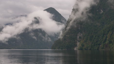 4K-footage-of-a-cloudy-Doubtful-Sound-taken-from-a-boat---Patea,-New-Zealand