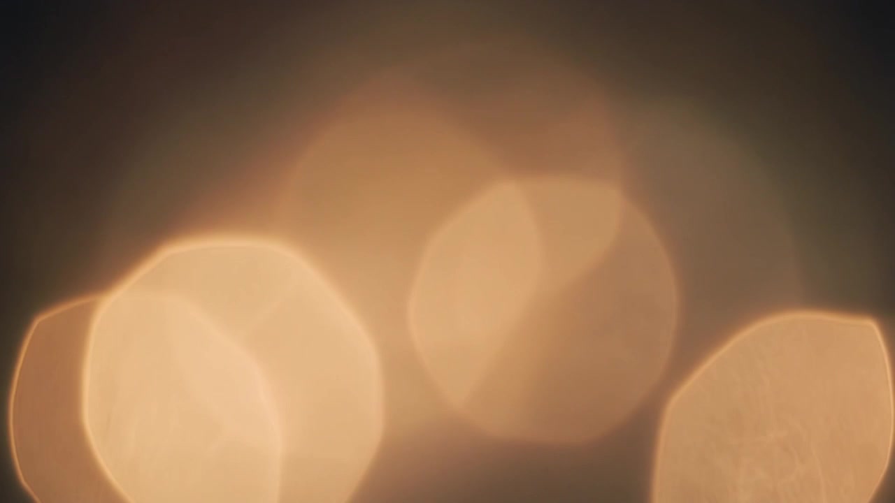 Abstract Golden Light Bokeh Background