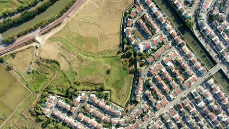 aerial pass above middle class suburban neighbourhood houses