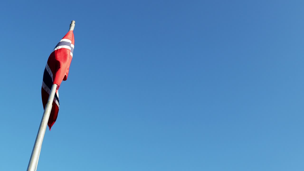 Bright Norwegian flag waving in the wind
