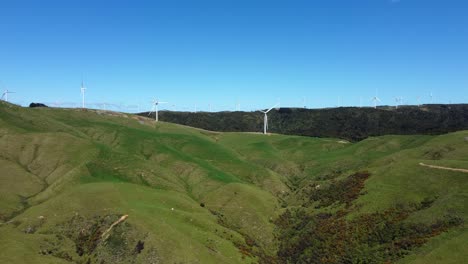 slowly ascending to reveal a wind farm high on a hill