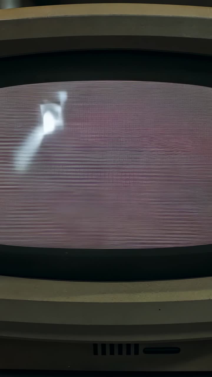 Vertical video: Power spike causing CRT at desk showing streak moving and fading over lines