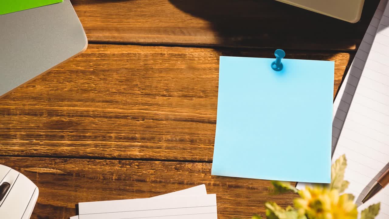 Animation of memo note with copy space over wooden desk
