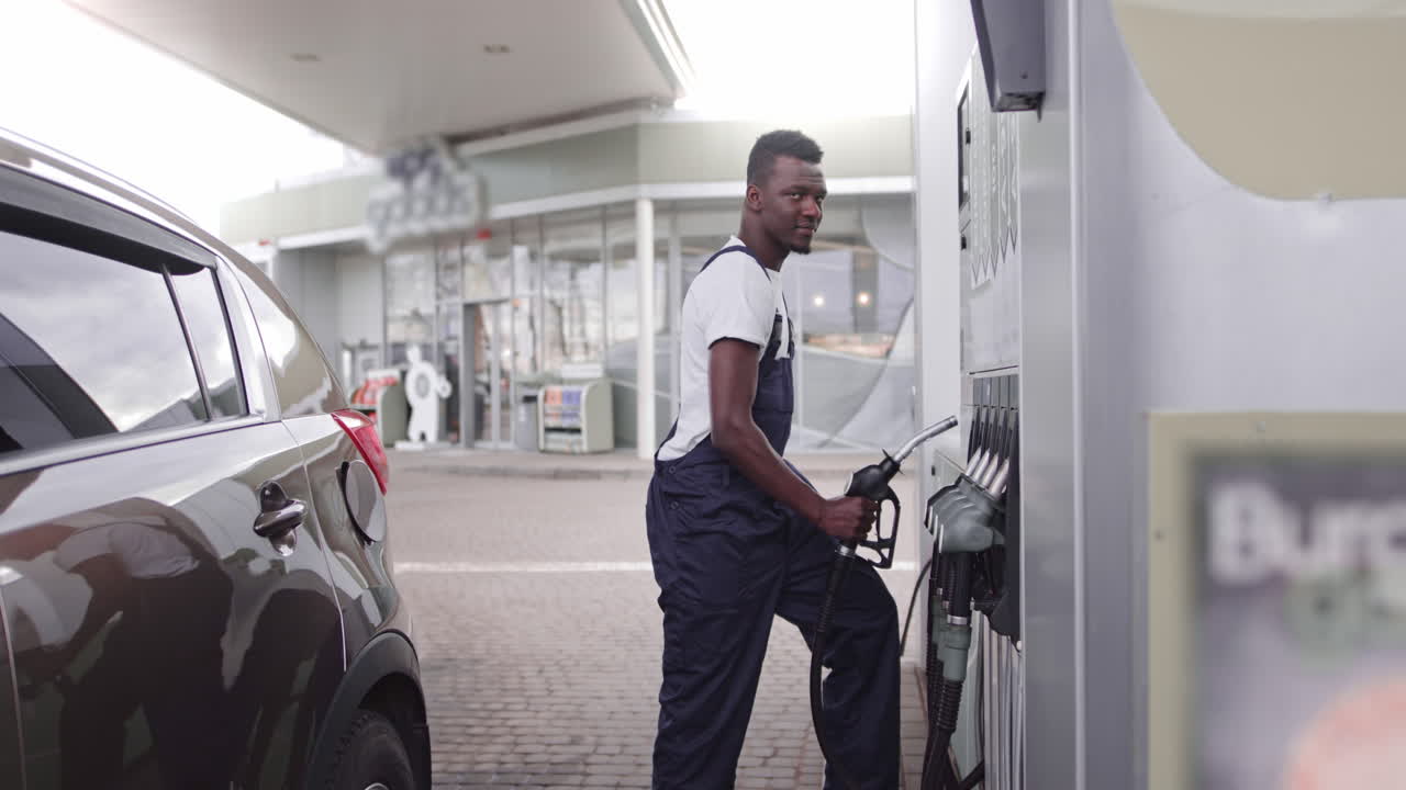 Man filling gas at a gas station