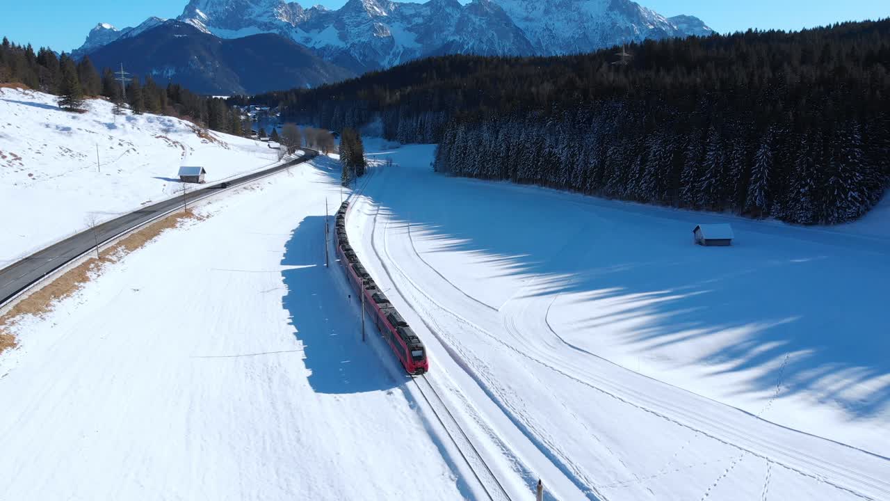 Aerial: train near Mittenwald with the Karwendel mountains as a background