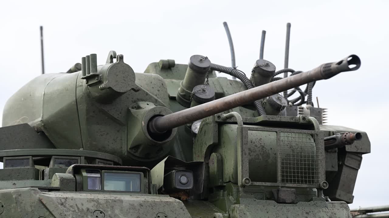 A close-up reveals the lethal weapon system of a Russian BMD-4M IFV. The 30mm autocannon, paired with advanced optics, gives it significant firepower in the Ukraine conflict