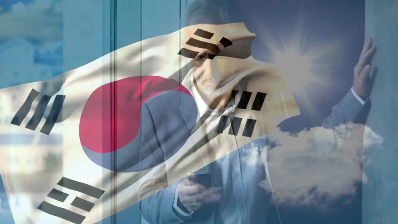 Using smartphone, man with South Korean flag overlay and animation in sunlight