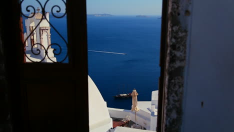 view through doors on the island of santorini in greece