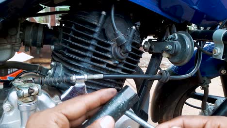 two-wheeler-motorbike-maintenance-at-day-from-flat-angle-in-details