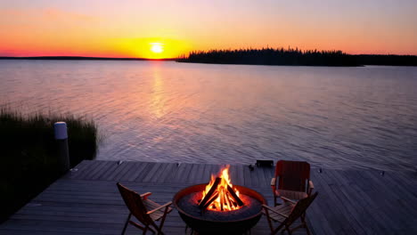 lakeside sunset with a glowing fire pit on a dock