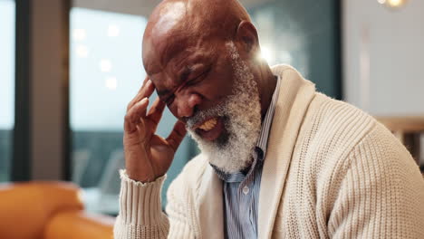 senior man experiencing headache pain