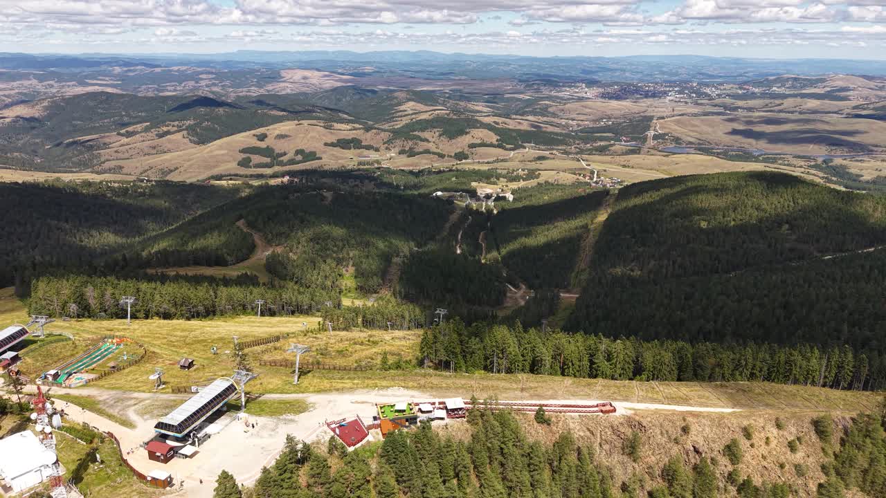 Zlatibor Mountain, Serbia. Ski Tracks and Gondola Station on Tornik Peak on Sunny Day, Drone Aerial View