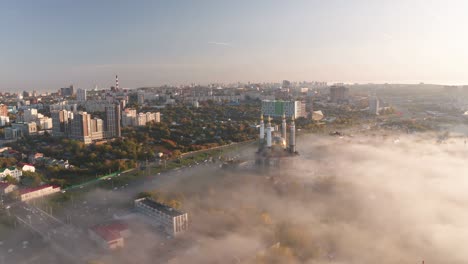 aerial view of ufa city. beautiful shoot of russians cities. view to ar-raheem under construction mosque in light fog.