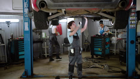 Woman-inspecting-automobile