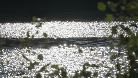 Bright-sun-flares-reflected-on-the-water's-surface