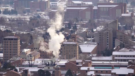 aerial view of smoke arising from industrial facilities