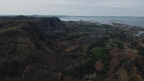 serpentine rock formations of mountains in leka norway - aerial shot