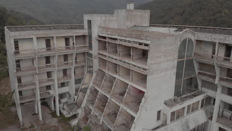 lowering next to a destroyed hotel