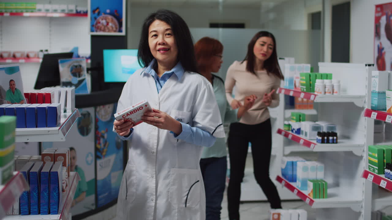 Pharmacist assisting customers in pharmacy