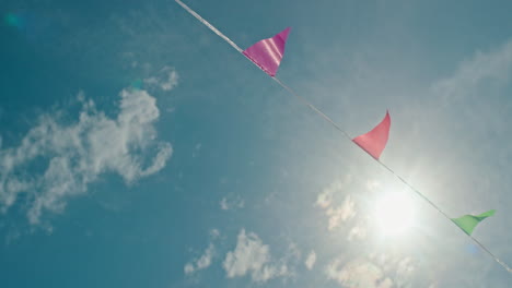 colorful flags against a blue sky