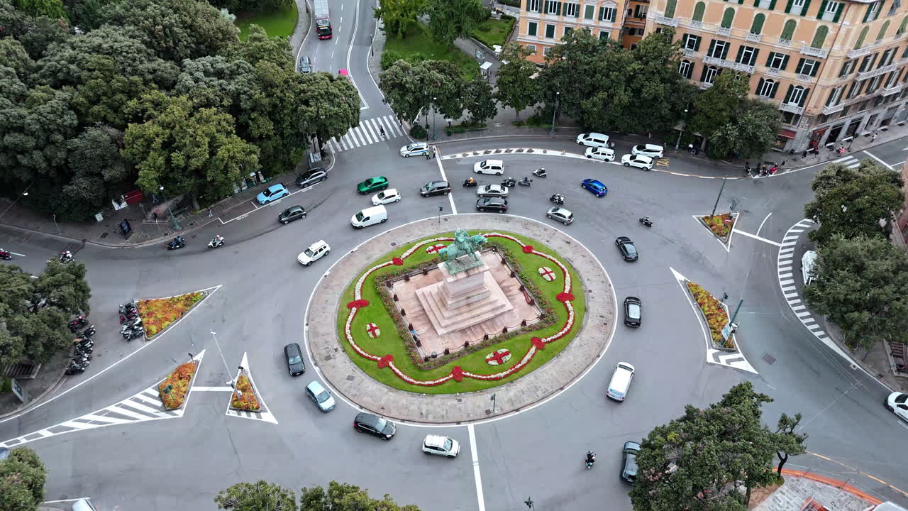 Top aerial view over Piazza Corvetto with traffic flow in Genoa, Italy