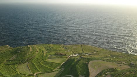 AERIAL:-Big-Waves-Washing-Coastline-of-Malta-on-a-Sunny-Evening-During-Winter