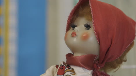 vintage porcelain doll with strawberry dress