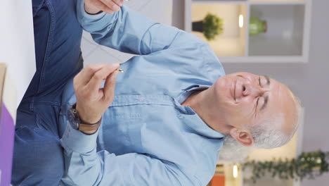 Vertical-video-of-The-old-man-with-the-ring-is-excited.-Marriage-proposal.