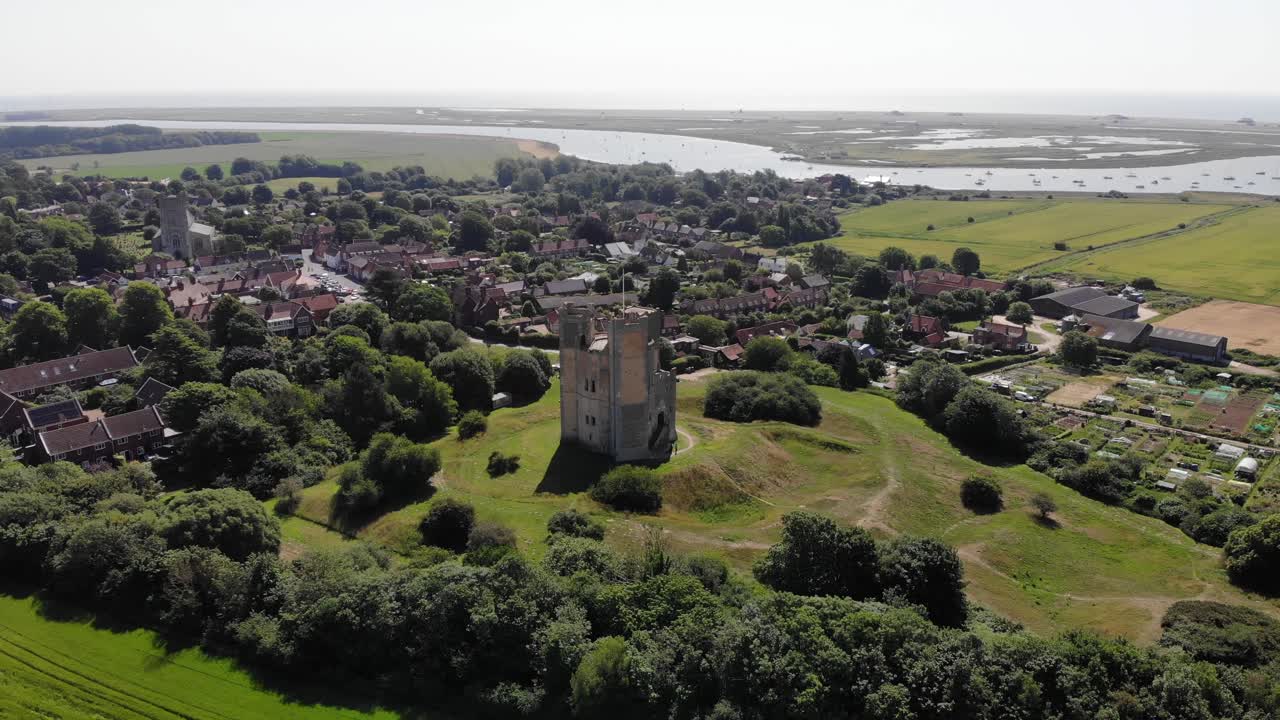 Rising drone shot showing Orford village in Suffolk. Orford is famous for its historical castle, its beautiful river Quay and picturesque architecture. Orford, Suffolk, UK. 21.06.25