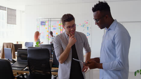 Front-view-of-young-mixed-race-business-team-shaking-hands-in-a-modern-office-4k