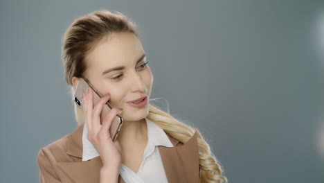 happy business woman calling mobile phone