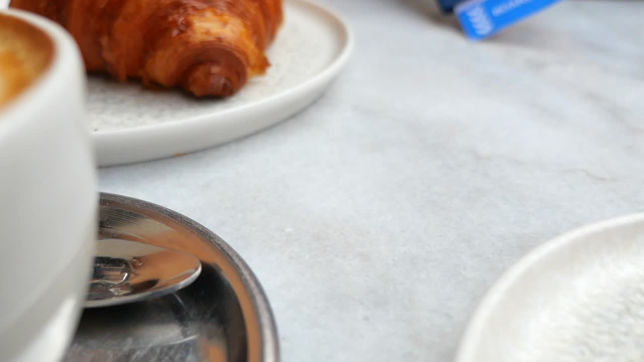 Passport, Boarding Pass, and Croissant Breakfast