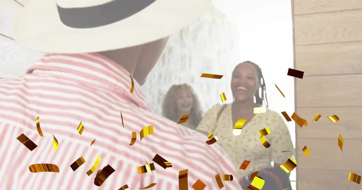 event entry adult man pulling door open, releasing golden confetti revealing friends greeting him