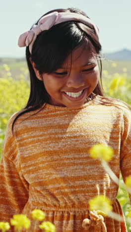 Happy-child,-flower-and-field-closeup