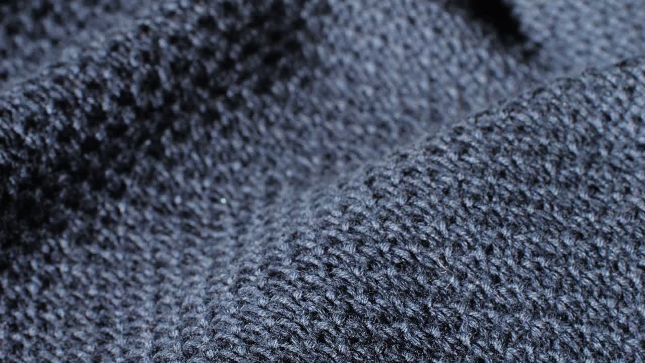 Close-up view of dark gray knitted fabric